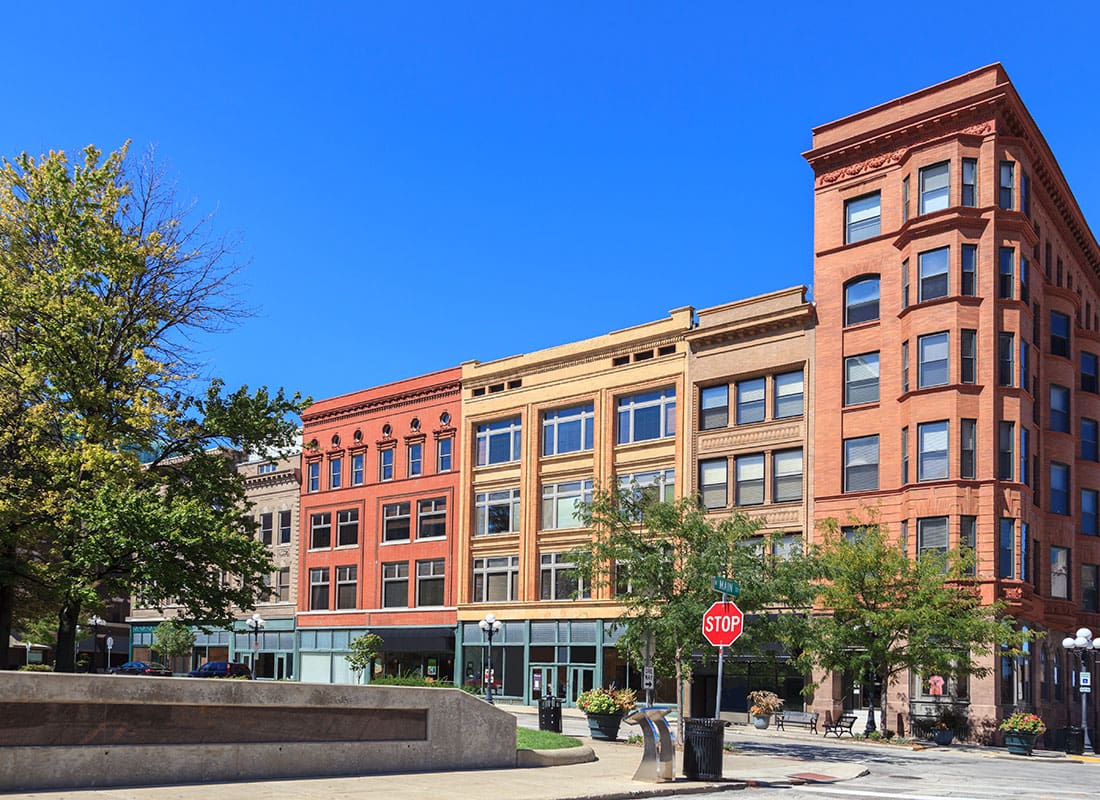 Bloomington, IL - Row of Historical Brick Buildings in Downtown Bloomington Illinois Against a Bright Blue Sky